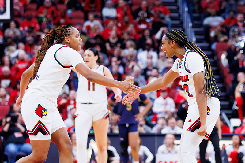 Tajianna Roberts and Mackenly Randolph celebrate during the game against Notre Dame at the KFC YUM Center on March 1, 2026.