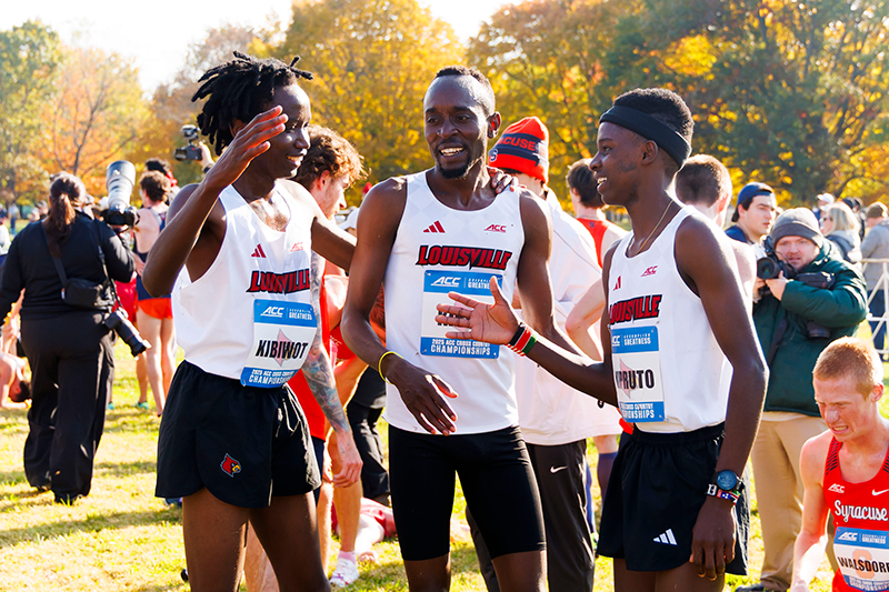 Geoffrey Kirwa, Elsingi Kipruto and Ian Kibiwot celebrate with each other after crossing the fishline at ACC Cross Country Championships in Louisville, Kentucky on October 31, 2025.